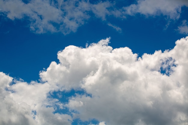 Free Photo white fluffy clouds in the clear sky