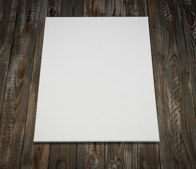 Free photo white poster on a wooden background