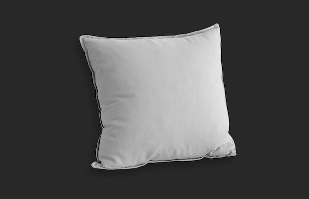 Free photo white square pillow over black surface