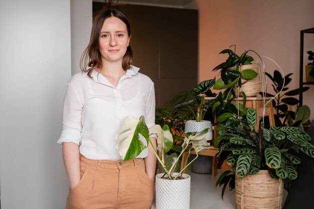 Woman growing plants at home