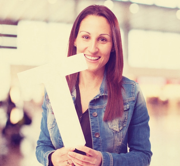 woman holding the T letter