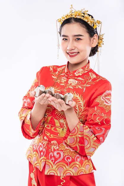 Free Photo woman wear cheongsam suit and black shoe ready to give the gift money to relative