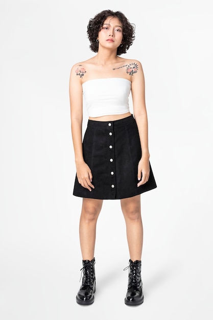 Free photo woman in white bandeau top and black a-line skirt with design space full body