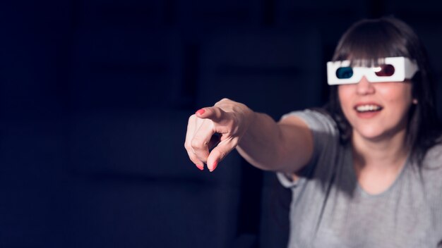 Free photo woman with 3d glasses in cinema