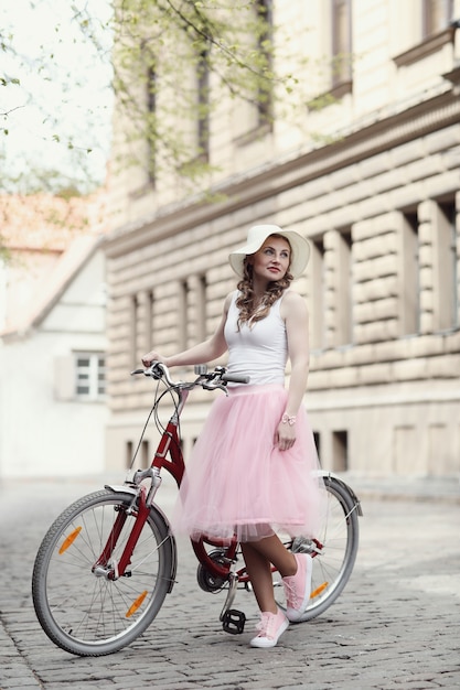 Free photo woman with bicycle