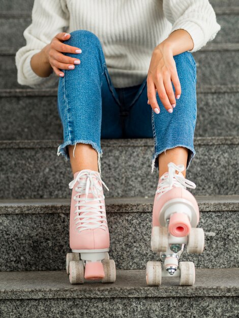 Woman with roller skates on stairs