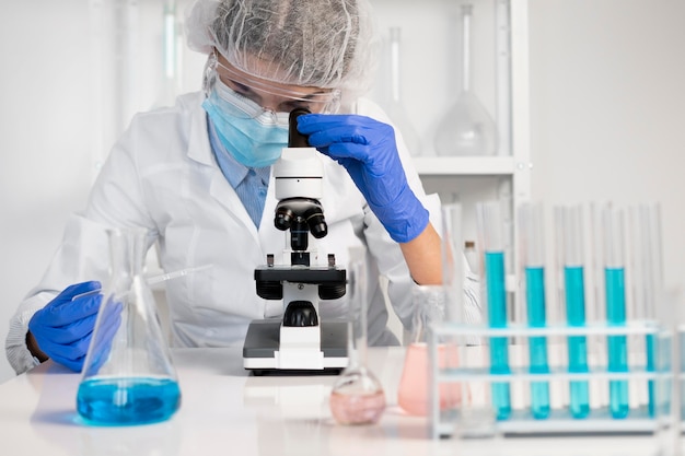 Free Photo woman working in laboratory close up