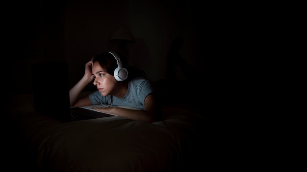 Woman working late at home