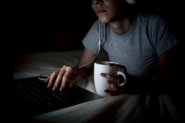 Free Photo woman working late on laptop