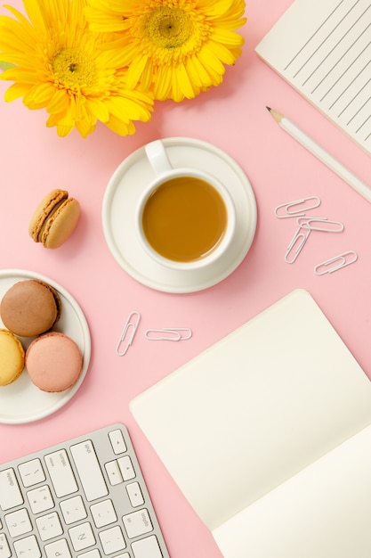 Free photo working woman pink desk