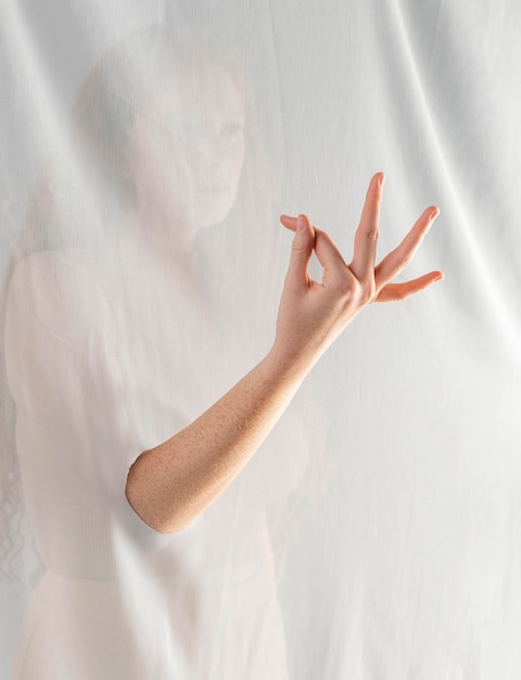 Free Photo young woman teaching sign language