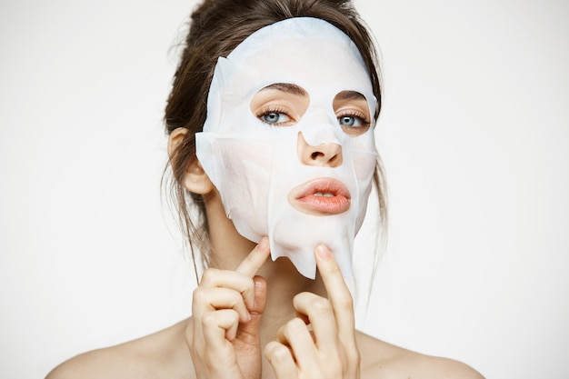 Free photo young woman with facial mask. beauty spa and cosmetology.