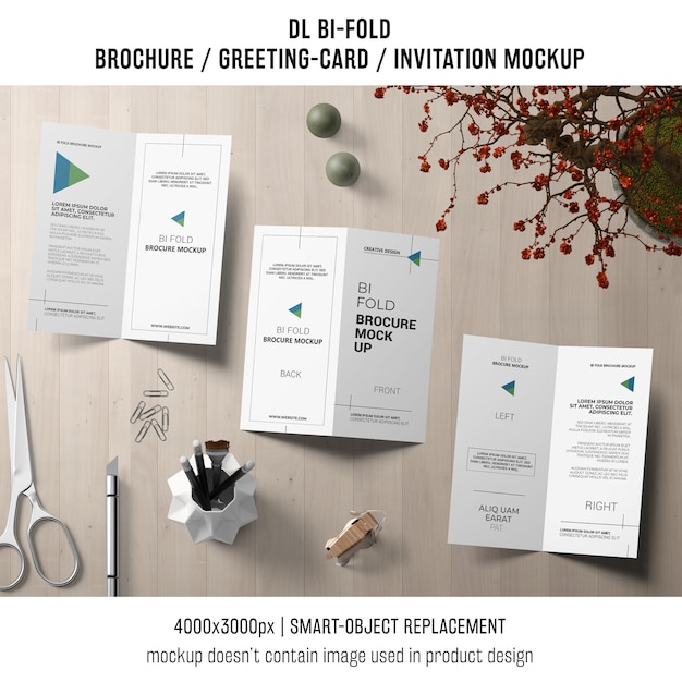 Free PSD bi-fold brochure or invitation mockup with still life concept
