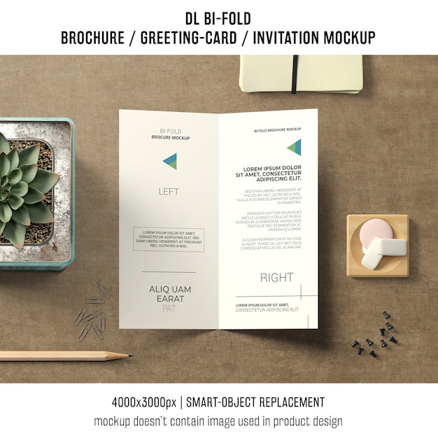 Free PSD bi-fold brochure or invitation mockup with still life concept