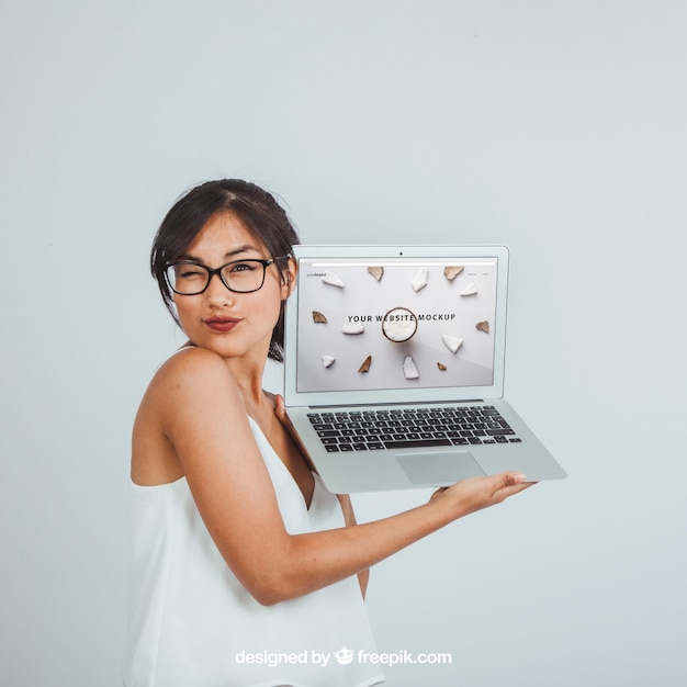 Free PSD design of mock up with winking woman and laptop