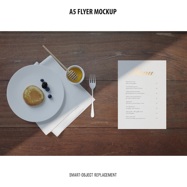 Free PSD flyer mockup in a desktop