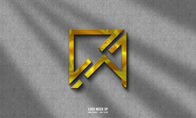 Free PSD gold logo mockup on grey wall