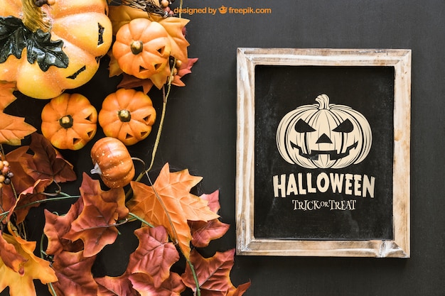 Free PSD halloween slate mockup with leaves and pumpkins