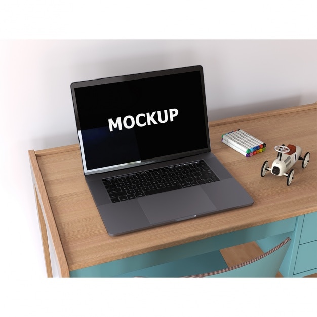 Free PSD laptop mockup on desk