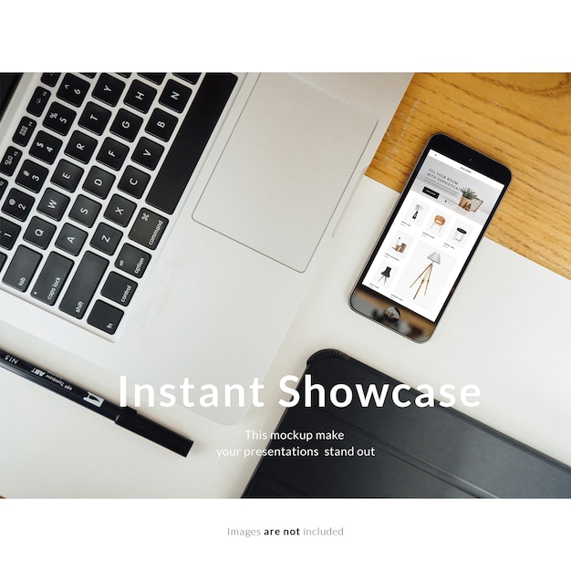Free PSD smartphone next to laptop mock up