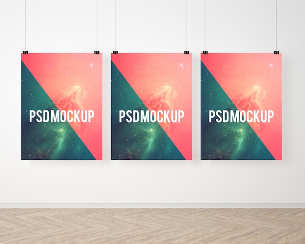 Free PSD three posters on white wall mock up