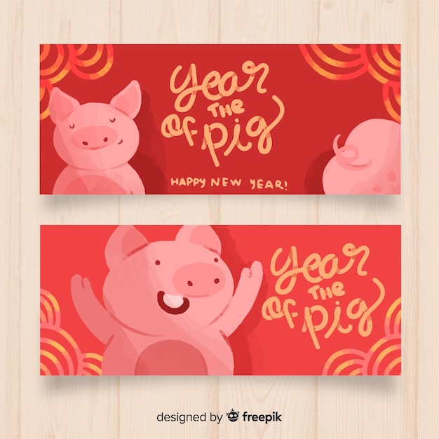 Free Vector hand drawn pig chinese new year banner