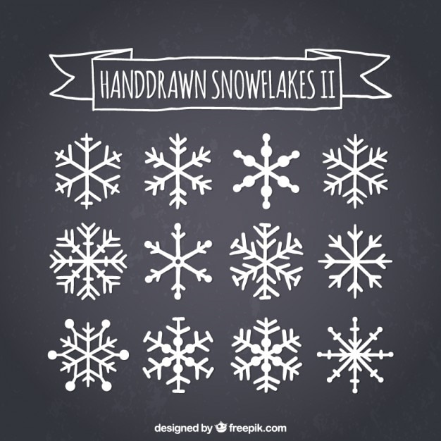 Free Vector hand drawn snowflakes on blackboard