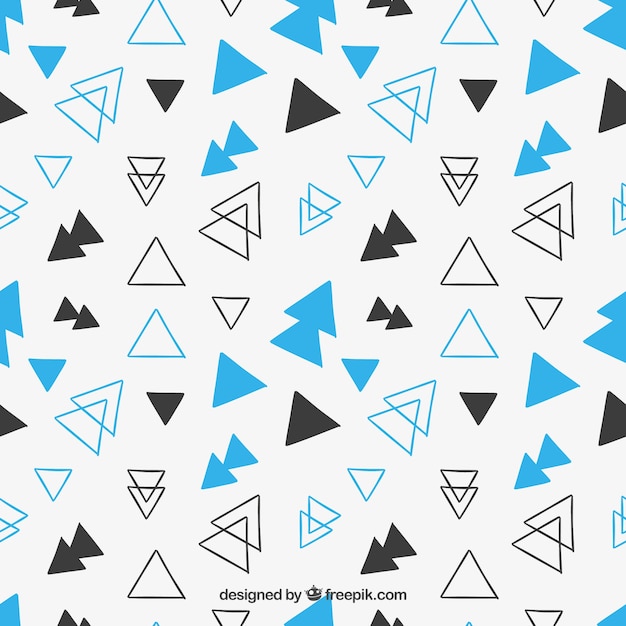 Free vector hand drawn triangles pattern