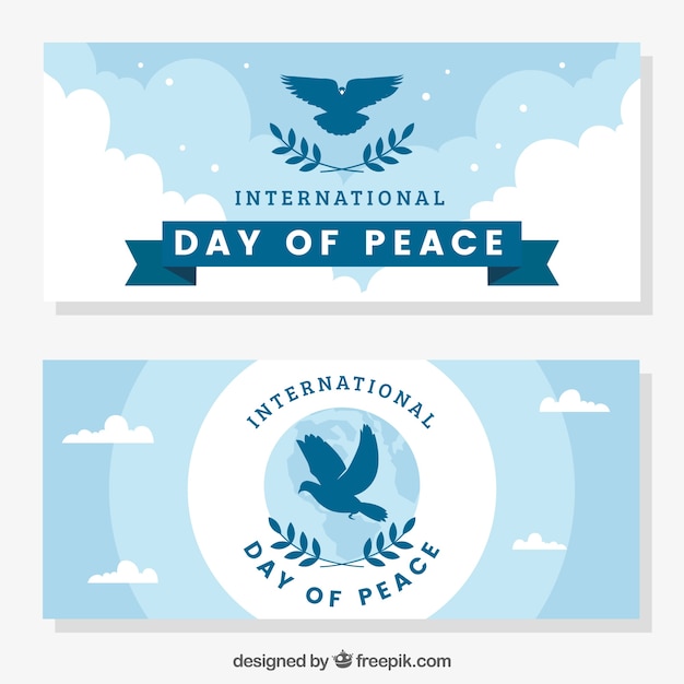 Free Vector peace day banners with pigeons silhouette