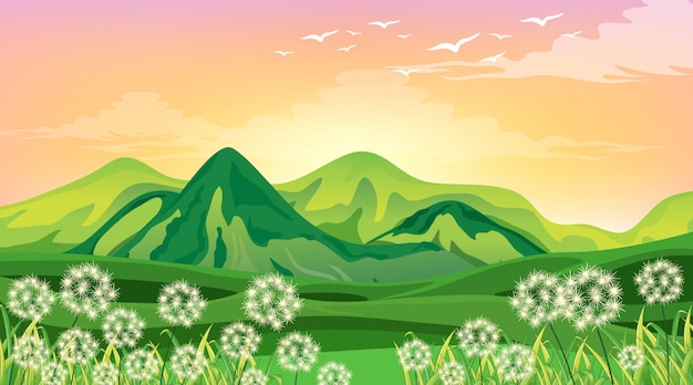 Free Vector scene with green mountains and field at sunset