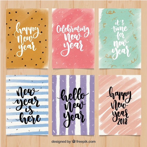 Free Vector set of abstract watercolor new year cards