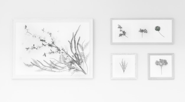 Photo gratuite dessin de fleurs à l'intérieur du cadre sur le mur