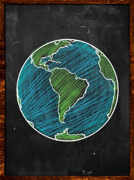 Photo gratuite green blue earth on blackboard globe