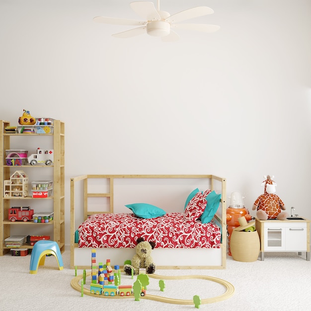 Chambre bébé avec des jouets devant le mur blanc