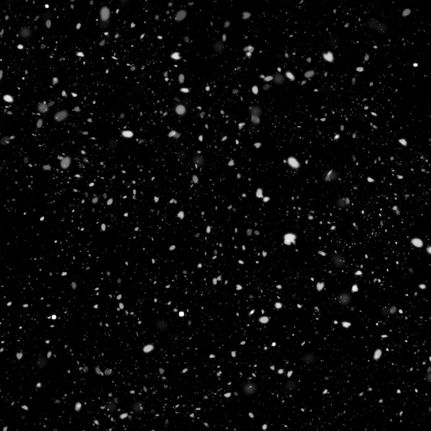 Photo effet de texture de neige blanche naturelle isolée sur fond de nuit noire