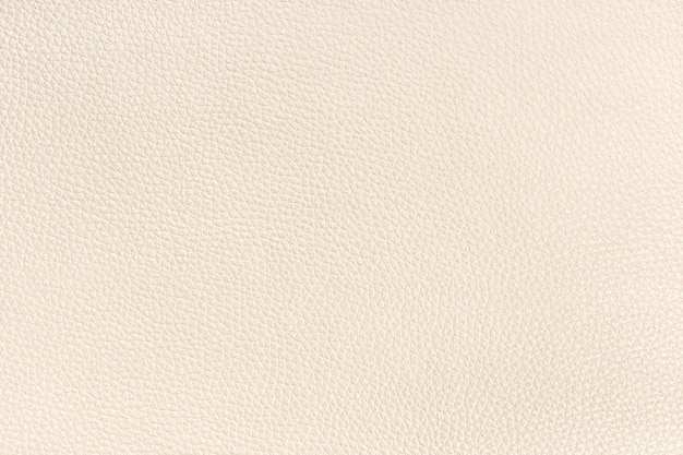 Photo texture de fond en cuir beige. plein cadre