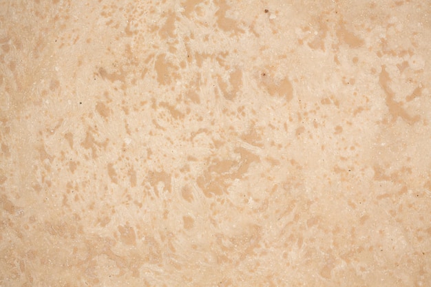 Photo texture travertin beige pour un intérieur individuel texture naturelle idéale pour votre design personnel