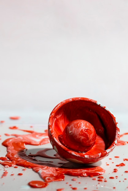 Abstract background with red paint splash and cup