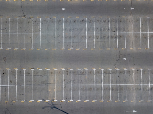 Photo aerial view from flying drones to parking markings with numbered places. parking background. top view