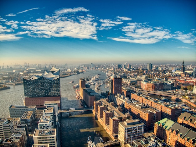 Photo aerial view of hamburg elbphilharmonie during summer under bright sky