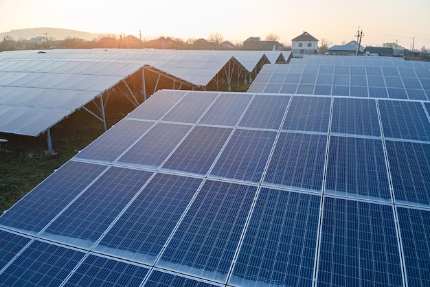 Aerial view of large sustainable electrical power plant with rows of solar photovoltaic panels for producing clean ecological electric energy Renewable electricity with zero emission concept