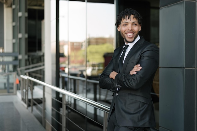 African businessman in suit at street