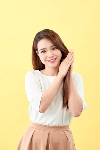 Photo asian young beautiful woman smiling and touching smooth her hair, natural make-up, beauty face, isolated over blue background.