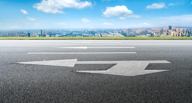 Background of asphalt pavement and urban architectural landscape skyline