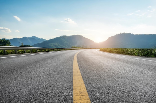 Background of asphalt pavement and urban architectural landscape skyline