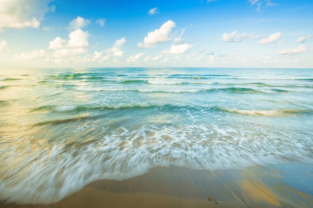 Beautiful early morning sunrise over and Wave of the sea