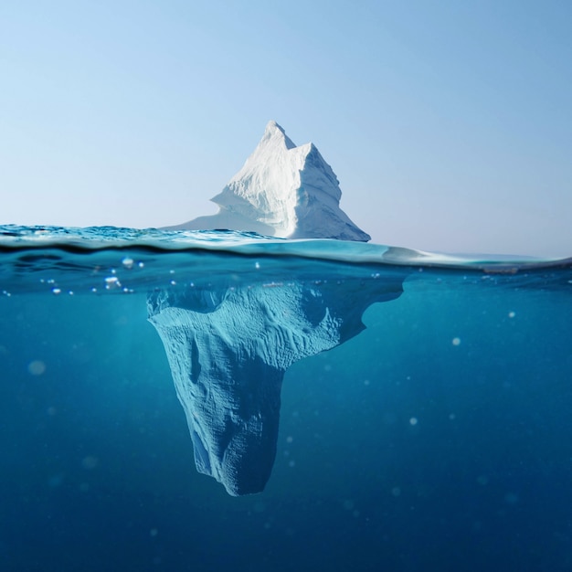 Beautiful iceberg in the ocean with a view under water. Global warming concept.