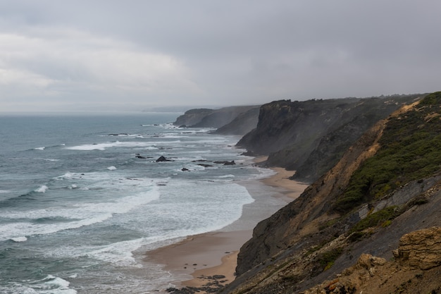 Beautiful rocky coastline and blue sea in Portugal