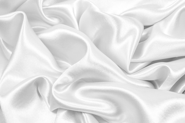 Beautiful smooth elegant silver silk or satin texture can use as abstract background. fabric color