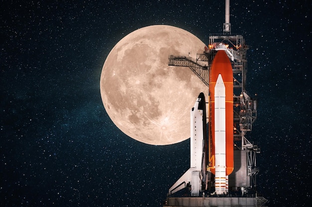 Beautiful space shuttle prepares for launch against the backdrop of an amazing full moon in the starry sky Space mission concept